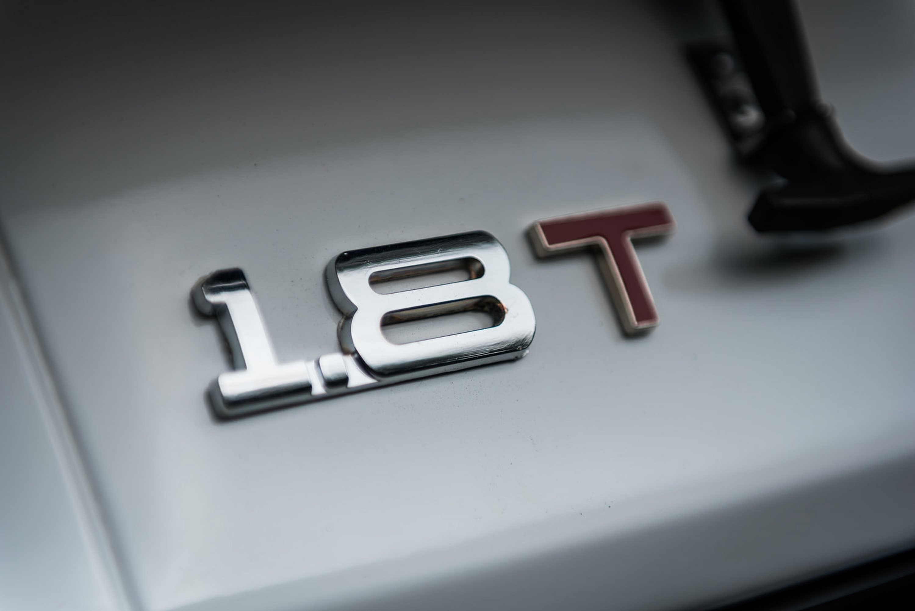 Rows of vehicles parked at a port ready for processing